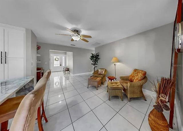 a kitchen with granite countertop a refrigerator and a sink