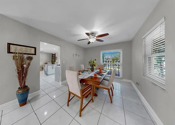 a bathroom with a granite countertop toilet sink and mirror