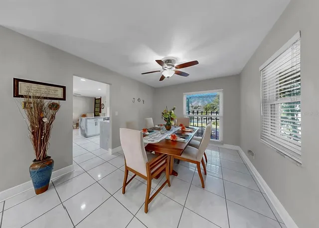 a bathroom with a granite countertop toilet sink and mirror