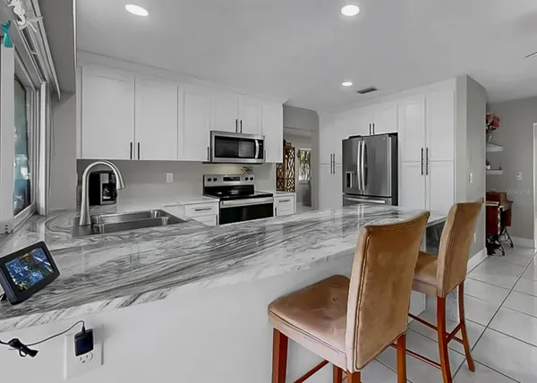 a bathroom with a toilet a sink a shower and mirror