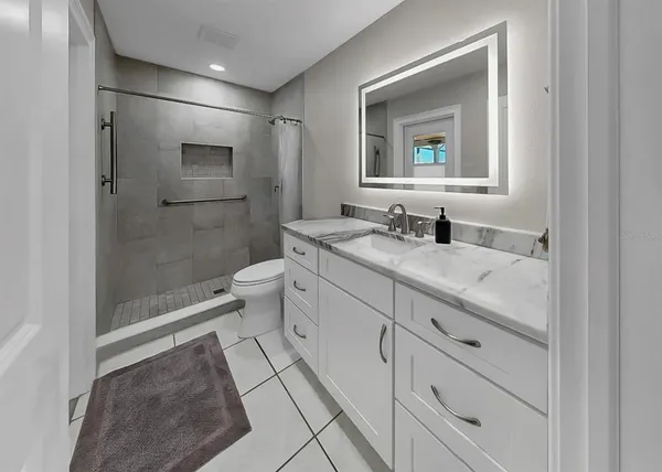 a view of a swimming pool with a patio