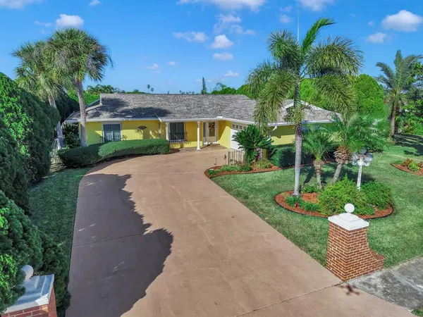a view of a lake with a house in the background