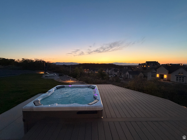 3626 Riverstone Road Mapleton, UT 84664 - Photo 6 of 58 Pool at dusk with a wooden deck, a residential view, and a yard