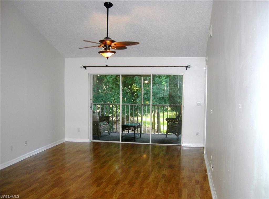3491 County Barn Road, Unit E201 Naples, FL 34112 - Photo 1 of 15 a view of a room with a flat screen tv