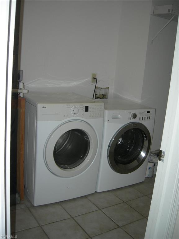 3491 County Barn Road, Unit E201 Naples, FL 34112 - Photo 11 of 15 a utility room with dryer and washer
