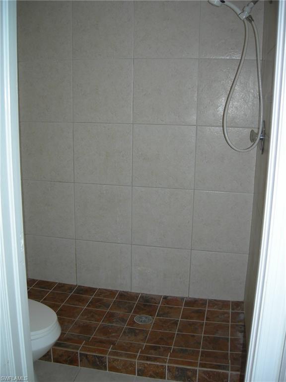3491 County Barn Road, Unit E201 Naples, FL 34112 - Photo 7 of 15 a bathroom with a shower