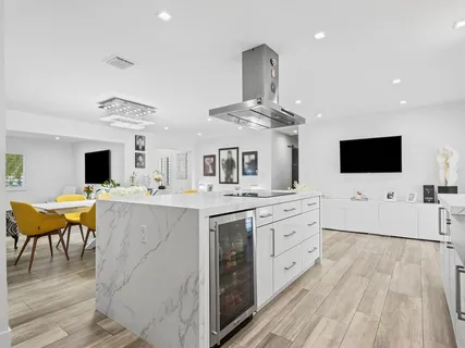 a view of a house with swimming pool and sitting area