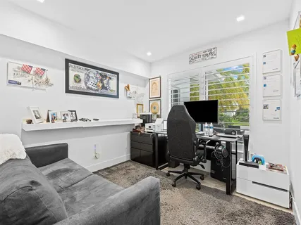 an aerial view of residential houses with city view