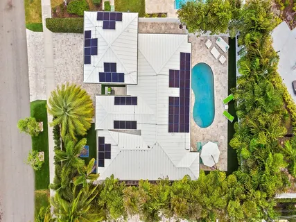 an aerial view of residential houses with city view