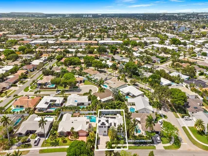 an aerial view of residential building with parking