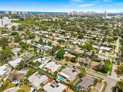 a house with palm tree in front of it