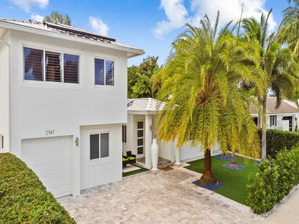 a swimming pool with outdoor seating and yard