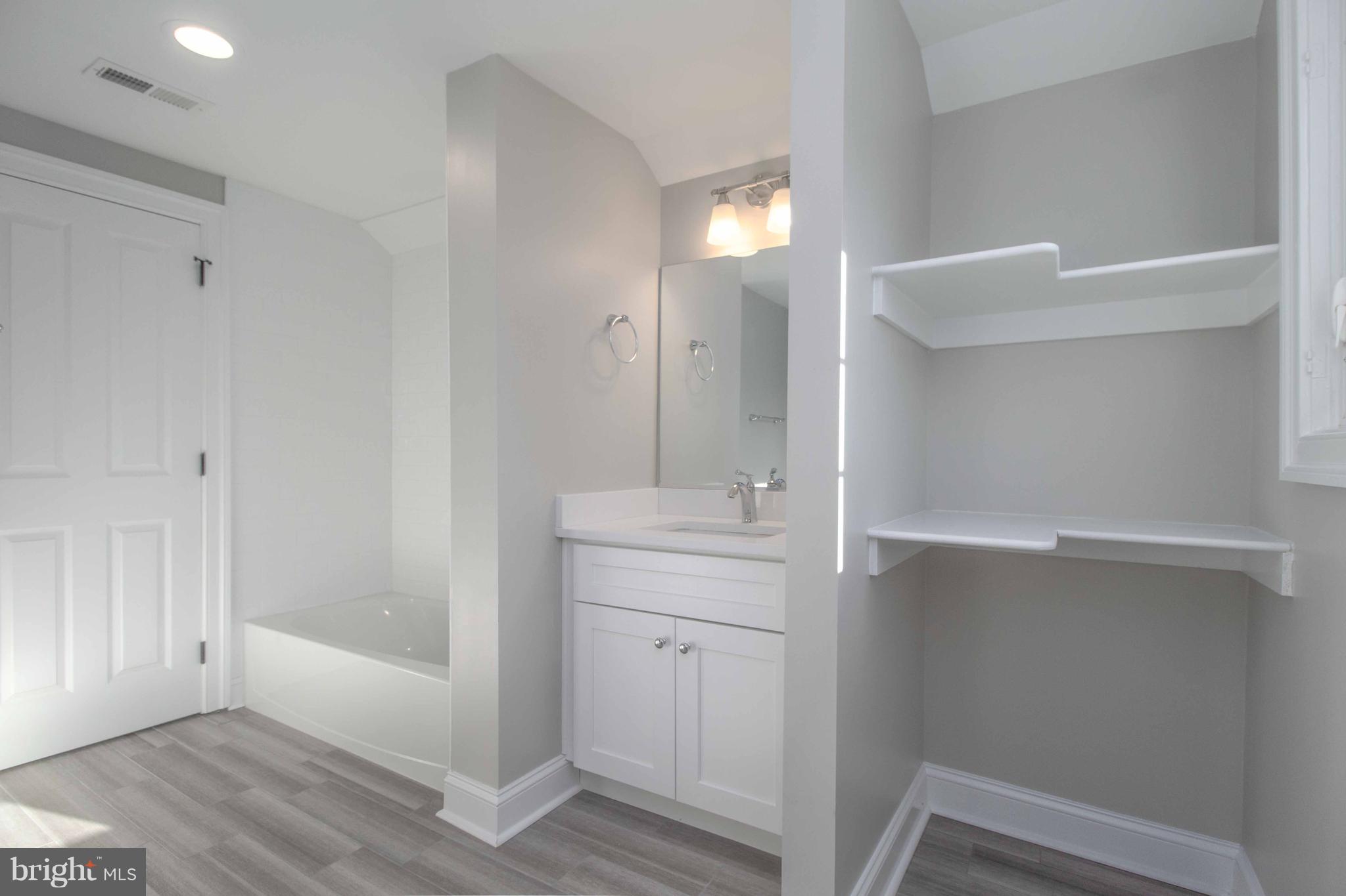 701 Brookwood Road Baltimore, MD 21229 - Photo 50 of 57 a bathroom with a bathtub and a sink