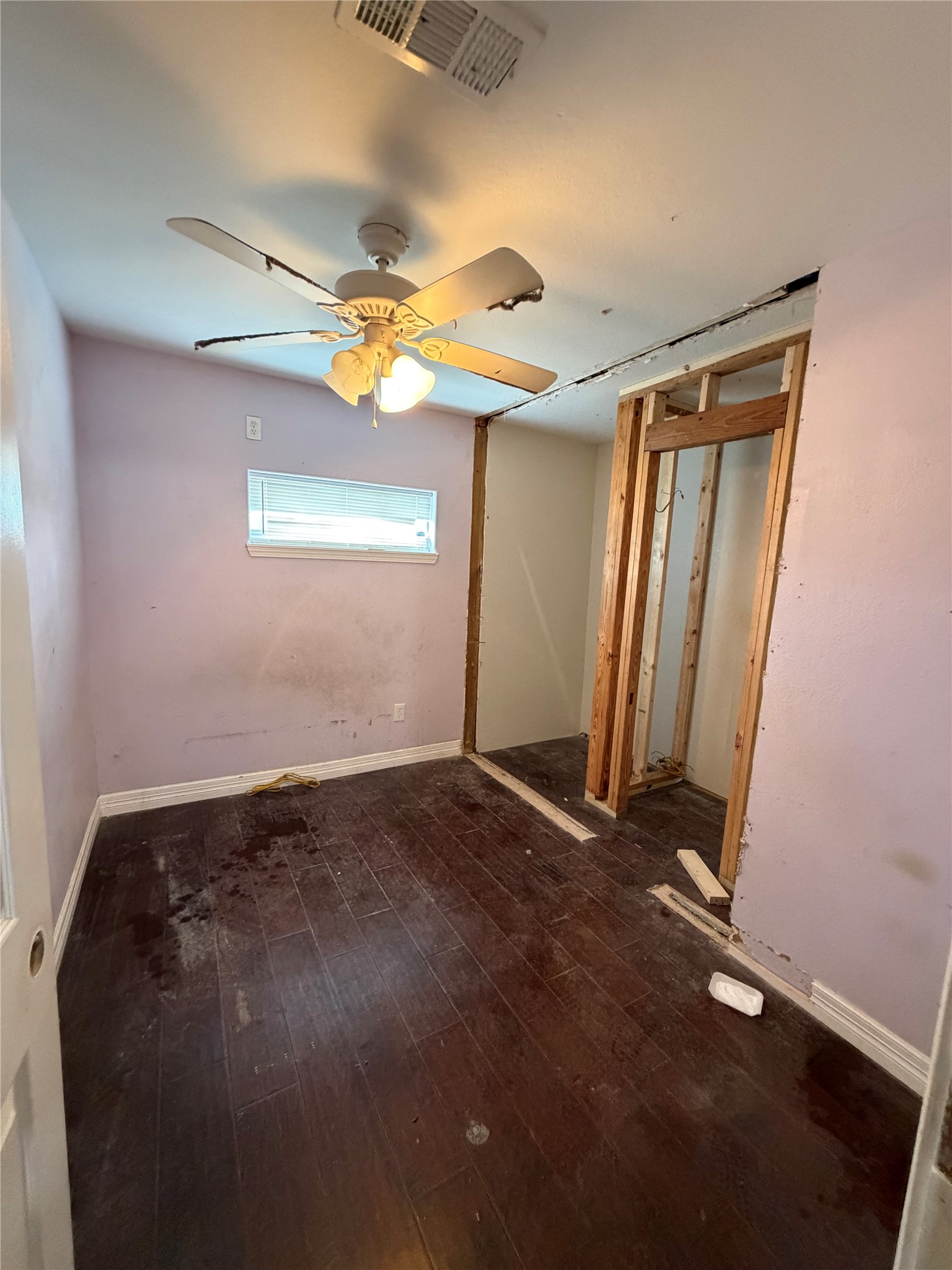 3508 Omega Street Houston, TX 77022 - Photo 14 of 15 an empty room with windows and fan