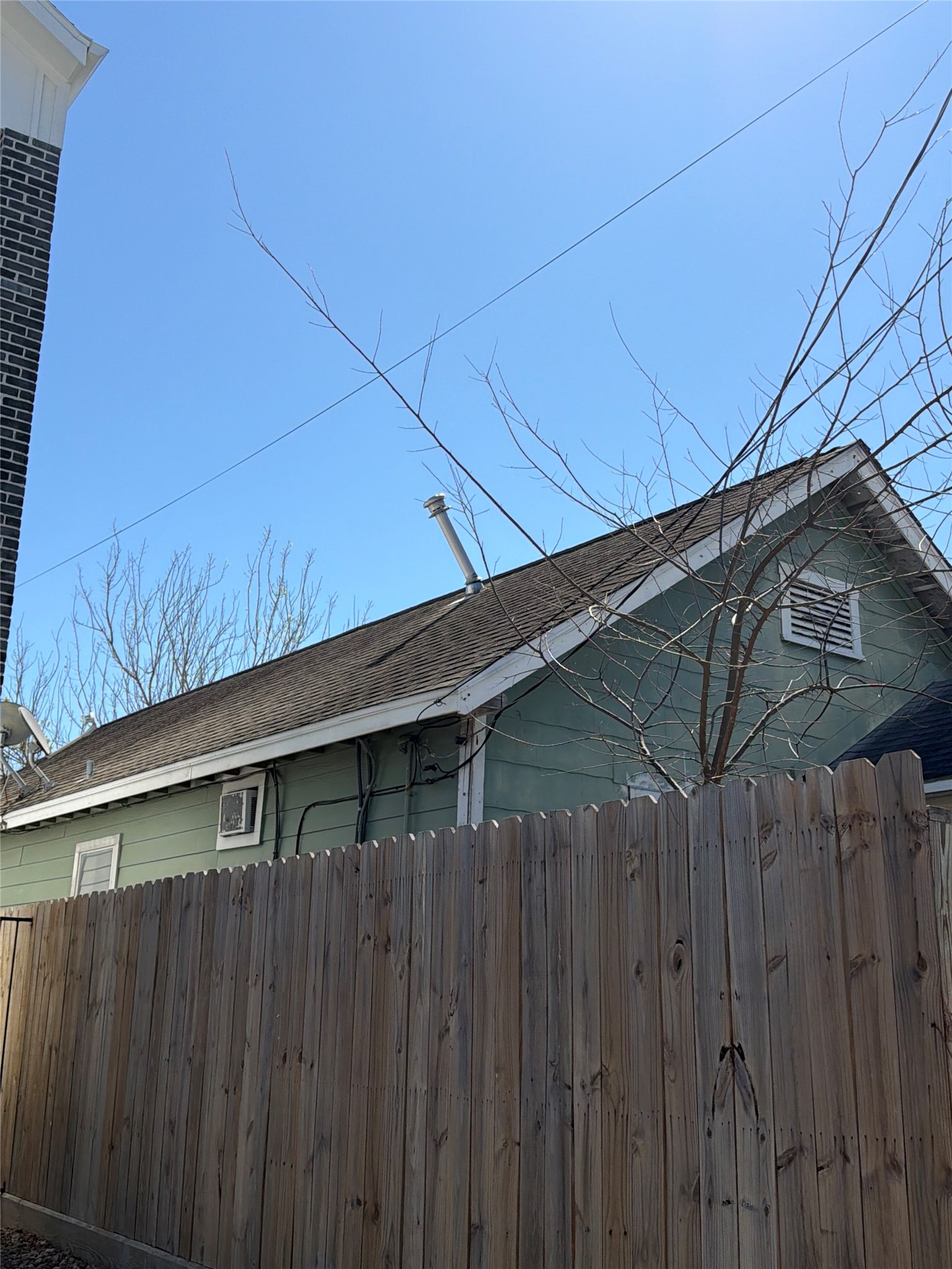 3508 Omega Street Houston, TX 77022 - Photo 15 of 15 a view of wooden fence and a buildings