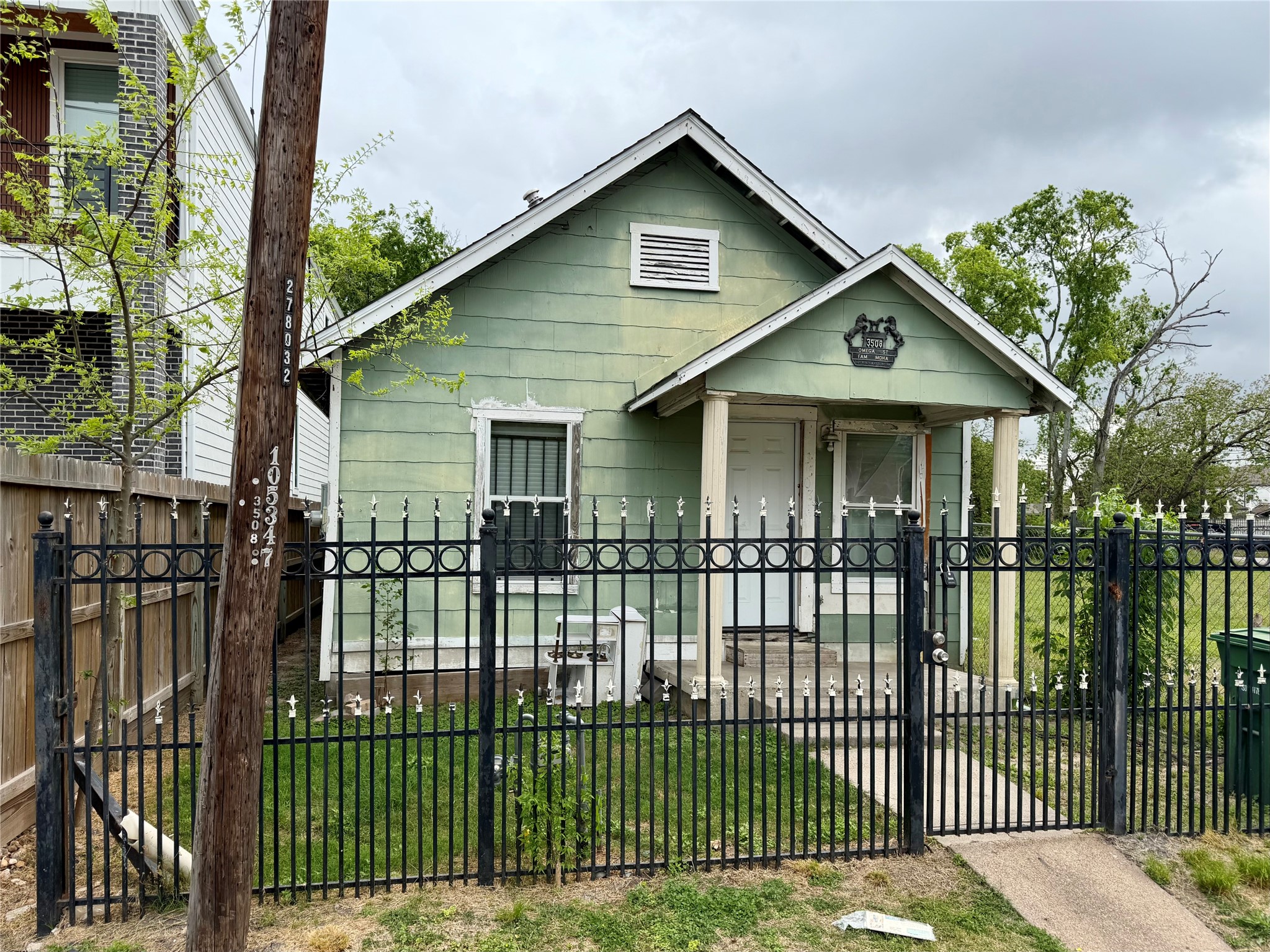 3508 Omega Street Houston, TX 77022 - Photo 3 of 15 a front view of a house with a garden and plants