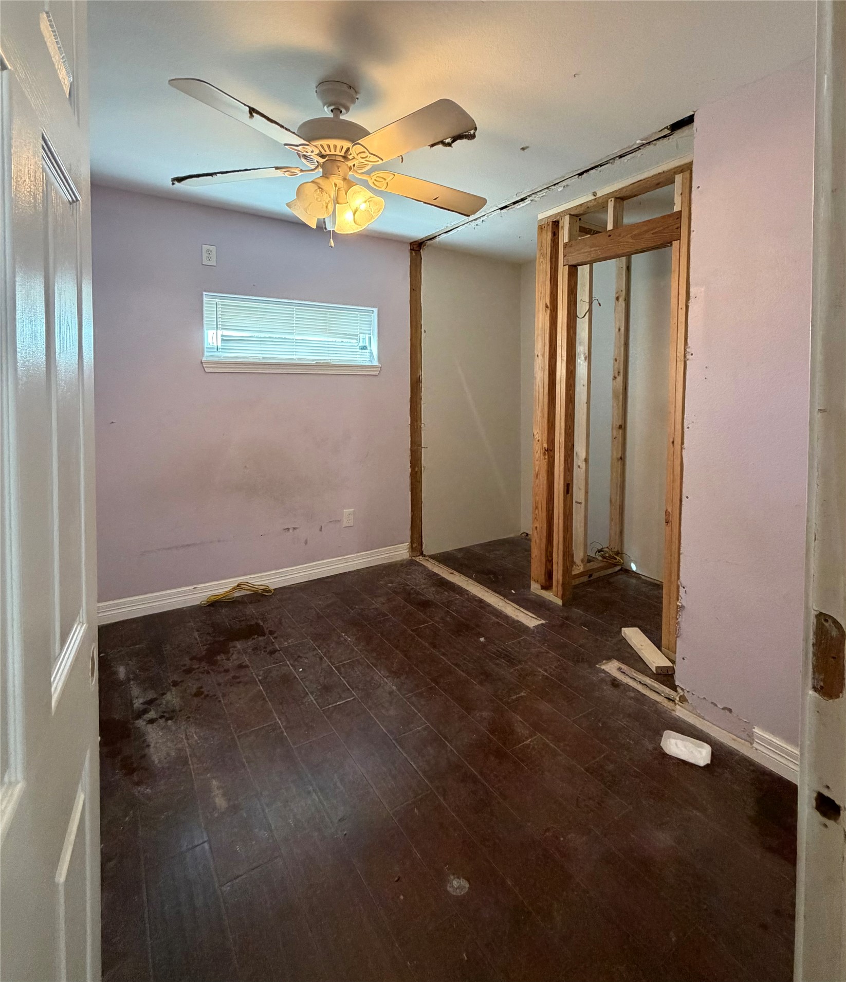 3508 Omega Street Houston, TX 77022 - Photo 6 of 15 an empty room with windows and fan