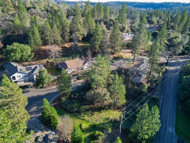an aerial view of house with yard