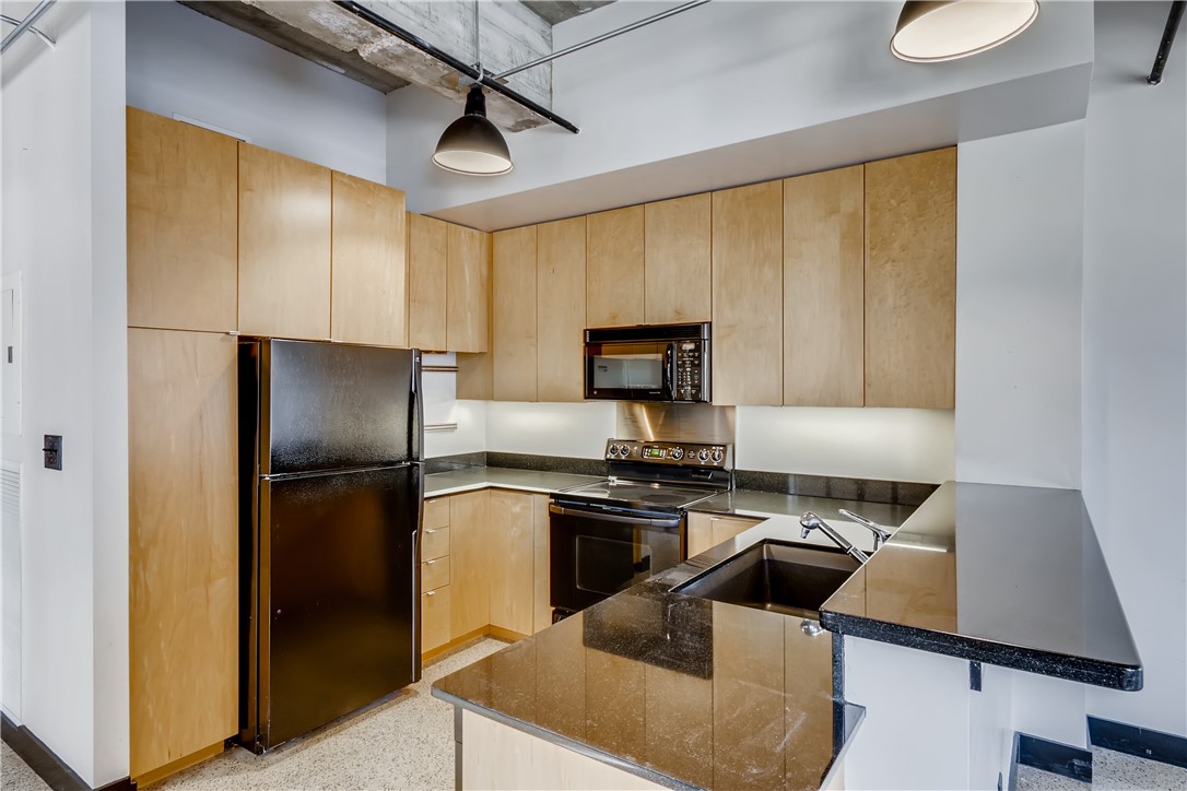 710 Colorado Street, Unit 4J Austin, TX 78701 - Photo 13 of 37 Tons of storage and counter space. Room for barstools!