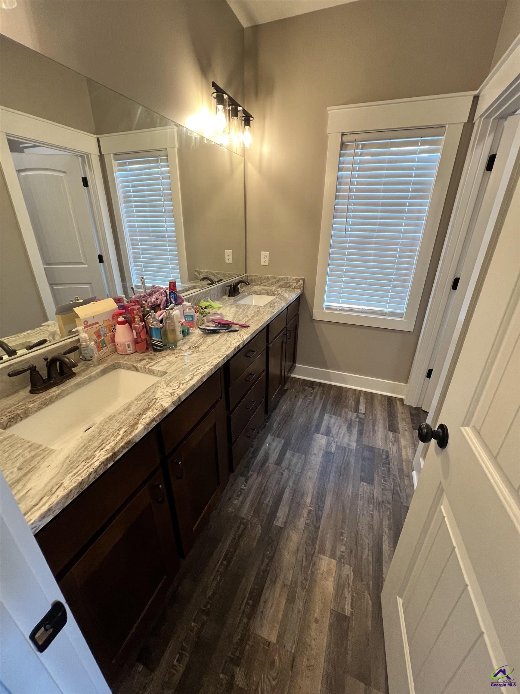2203 Old Macon Road Montrose, GA 31065 - Photo 41 of 64 a spacious bathroom with a granite countertop sink toilet a mirror and shower