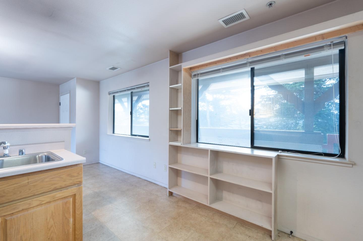 306 Reservation Road Marina, CA 93933 - Photo 12 of 23 a bathroom with a window sink and mirror