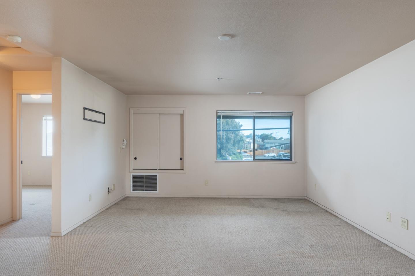 306 Reservation Road Marina, CA 93933 - Photo 14 of 23 an empty room with a window