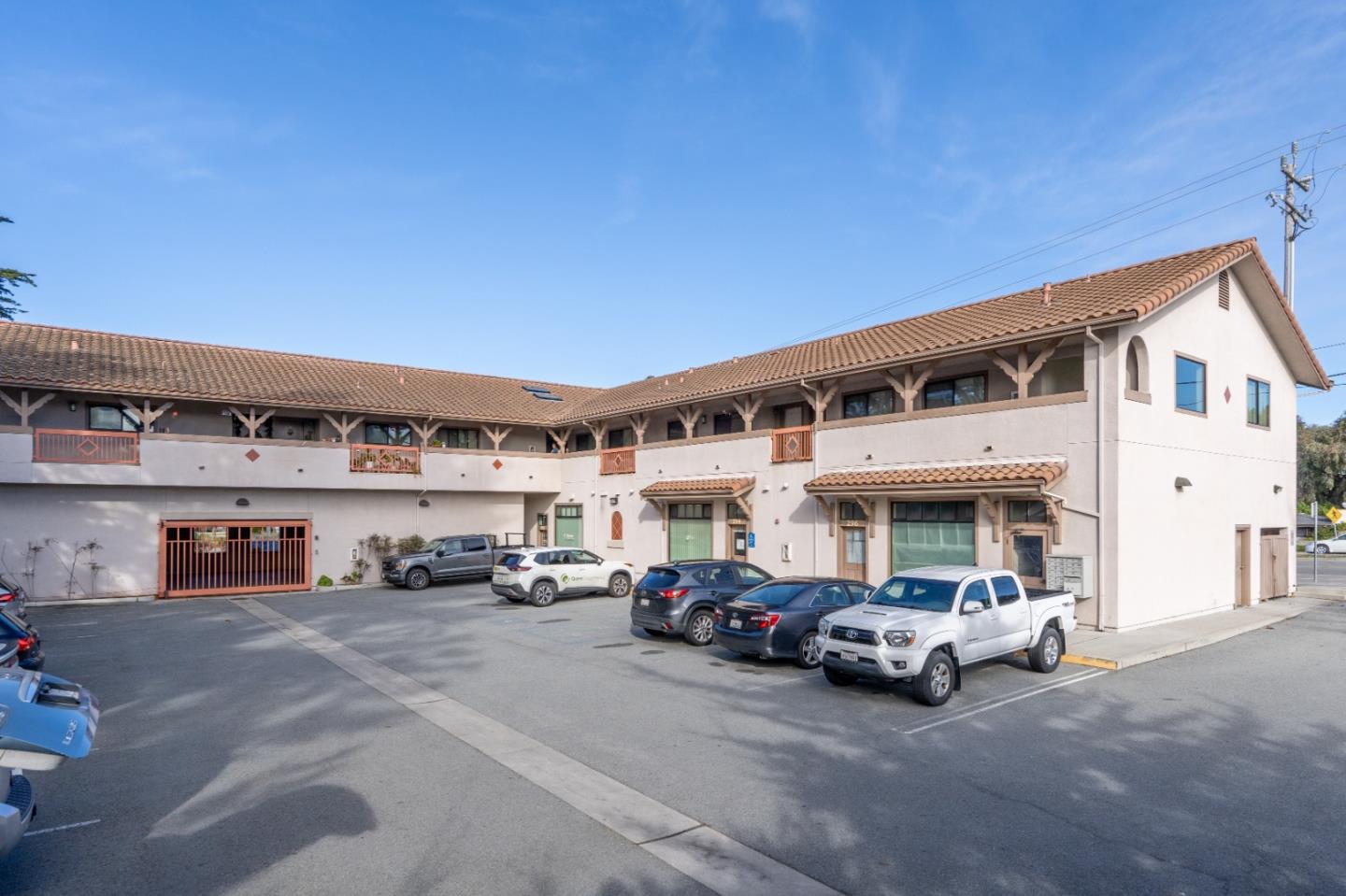 306 Reservation Road Marina, CA 93933 - Photo 2 of 23 a view of a cars parking in front of a building