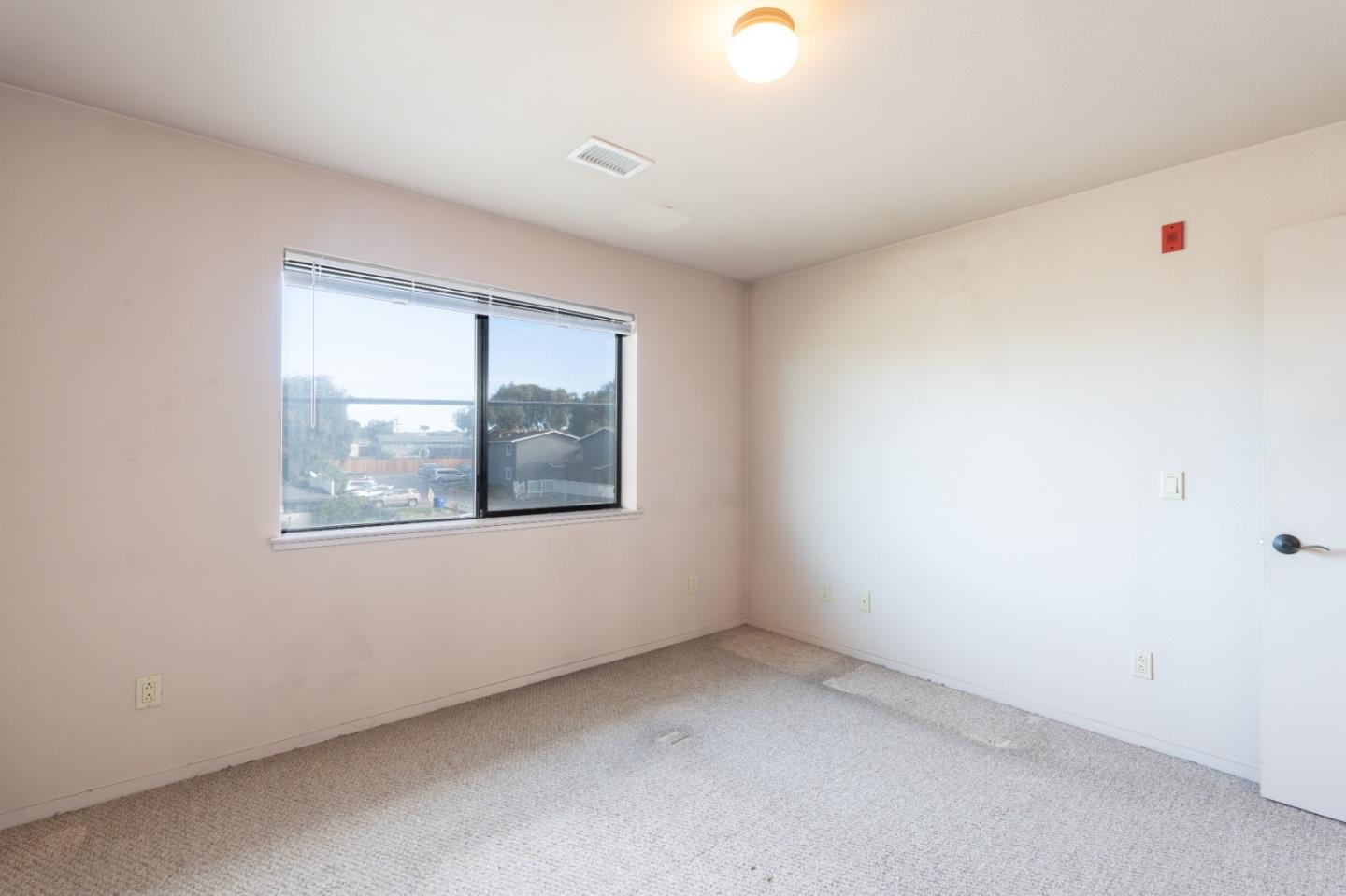 306 Reservation Road Marina, CA 93933 - Photo 21 of 23 an empty room with a window