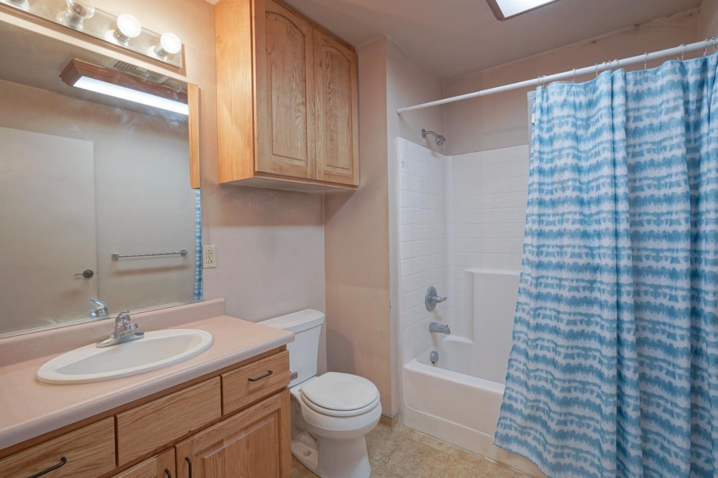 306 Reservation Road Marina, CA 93933 - Photo 22 of 23 a bathroom with a granite countertop sink toilet and shower