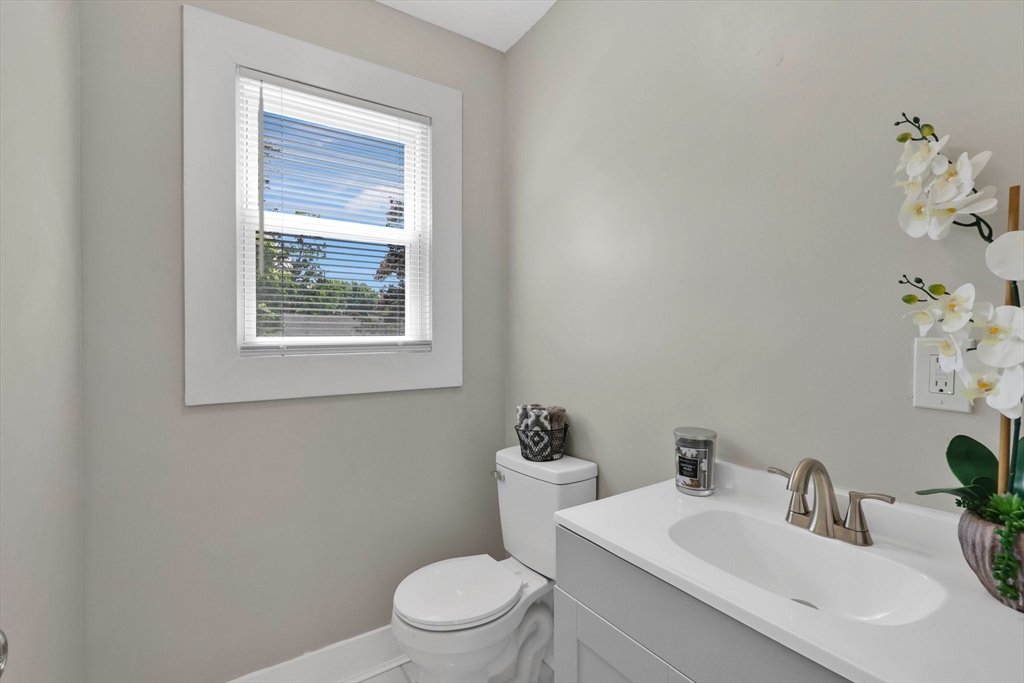 171 Boston Road Springfield, MA 01109 - Photo 12 of 33 a bathroom with a toilet sink and mirror