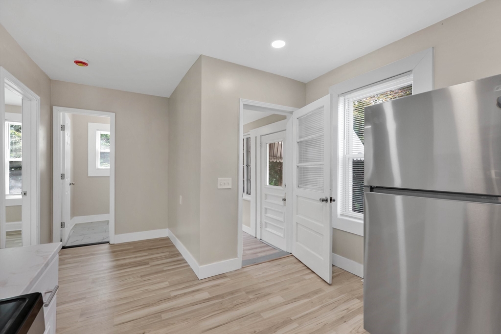 171 Boston Road Springfield, MA 01109 - Photo 19 of 33 a view of a refrigerator in kitchen and wooden floor