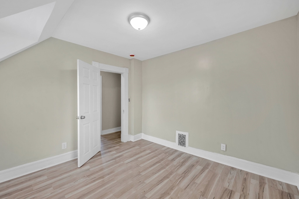 171 Boston Road Springfield, MA 01109 - Photo 26 of 33 a view of an empty room with wooden floor