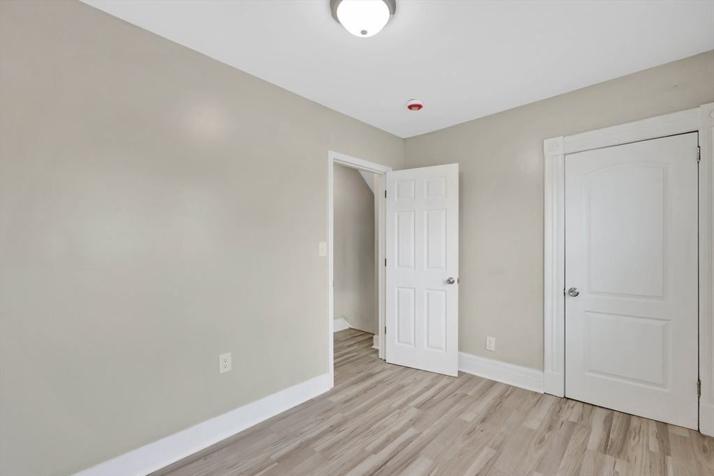 171 Boston Road Springfield, MA 01109 - Photo 28 of 33 a view of an empty room with wooden floor