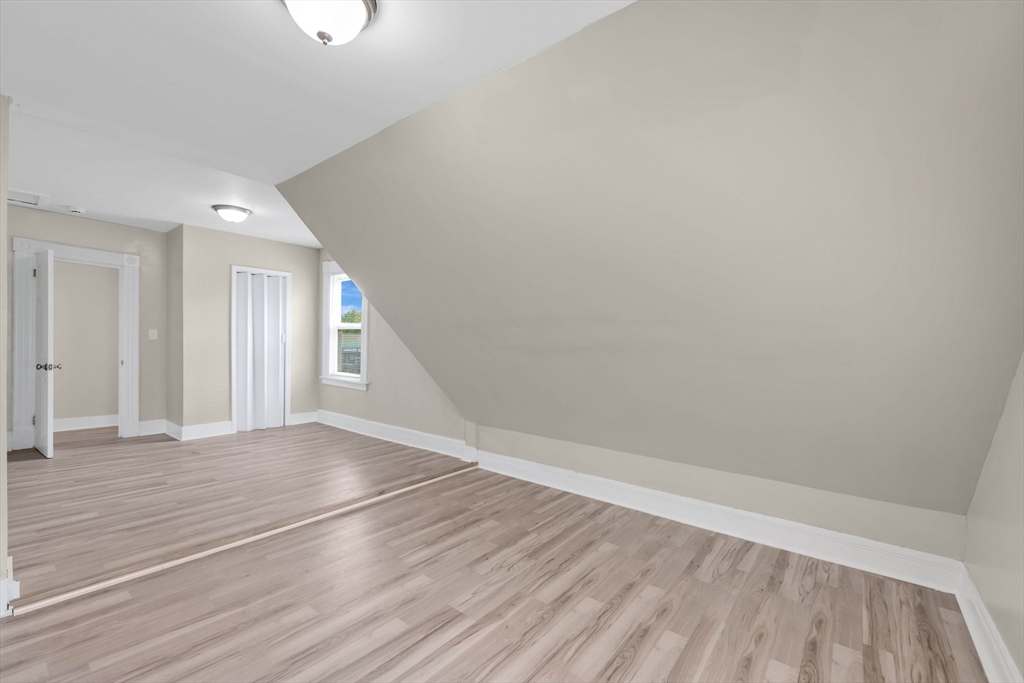 171 Boston Road Springfield, MA 01109 - Photo 31 of 33 a view of an empty room with wooden floor and a window