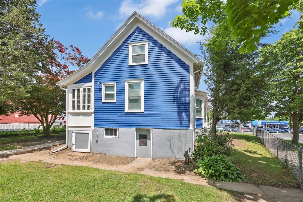 171 Boston Road Springfield, MA 01109 - Photo 4 of 33 a view of a house with a yard