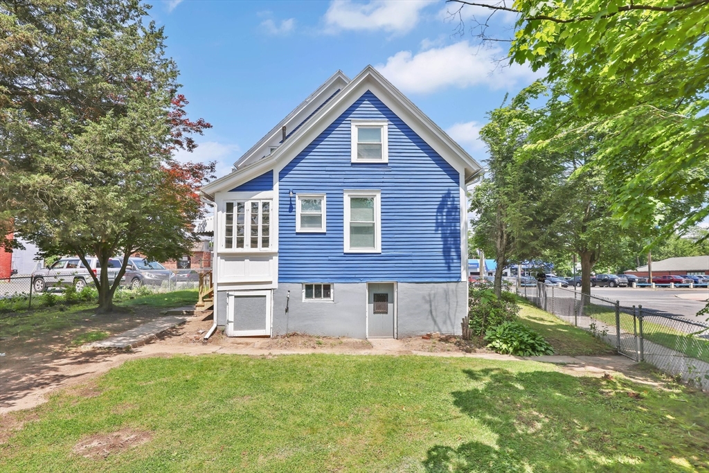171 Boston Road Springfield, MA 01109 - Photo 5 of 33 a front view of a house with a yard