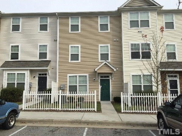 a view of a house with a fence