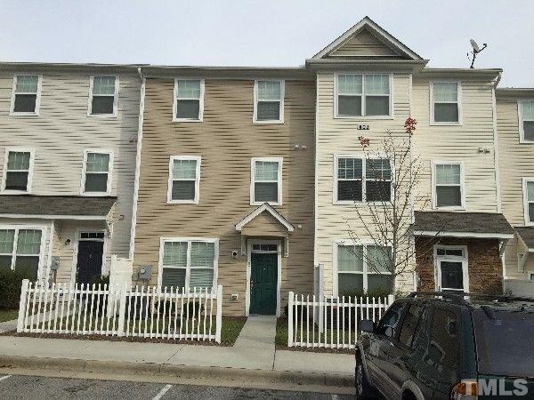 401 Coalinga Lane, Unit 102 Raleigh, NC 27610 - Photo 2 of 12 a front view of a house with a porch