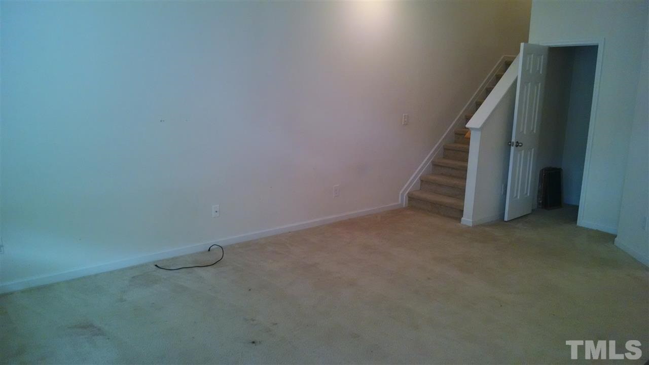 401 Coalinga Lane, Unit 102 Raleigh, NC 27610 - Photo 3 of 12 a view of an empty room