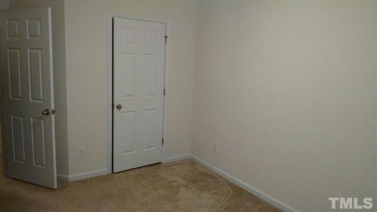 401 Coalinga Lane, Unit 102 Raleigh, NC 27610 - Photo 9 of 12 a view of an empty room