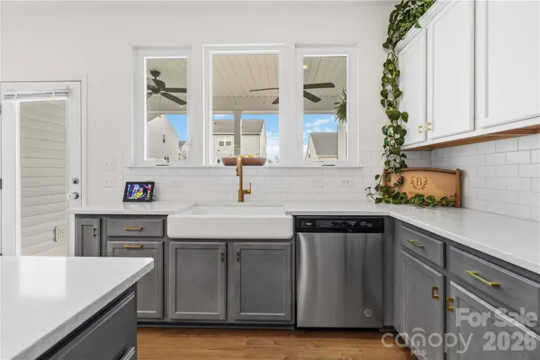 a kitchen with a sink and cabinets