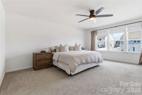 a bedroom with bed and window