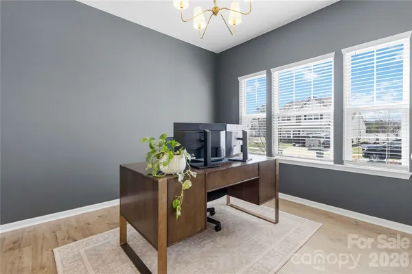 a view of a workspace with furniture