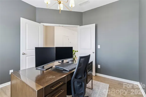 a view of a workspace with furniture