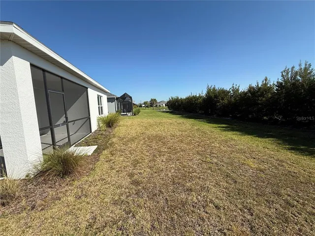 a backyard of a house with lots of green space