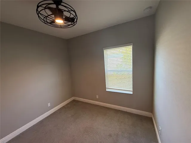 an empty room with a space and window