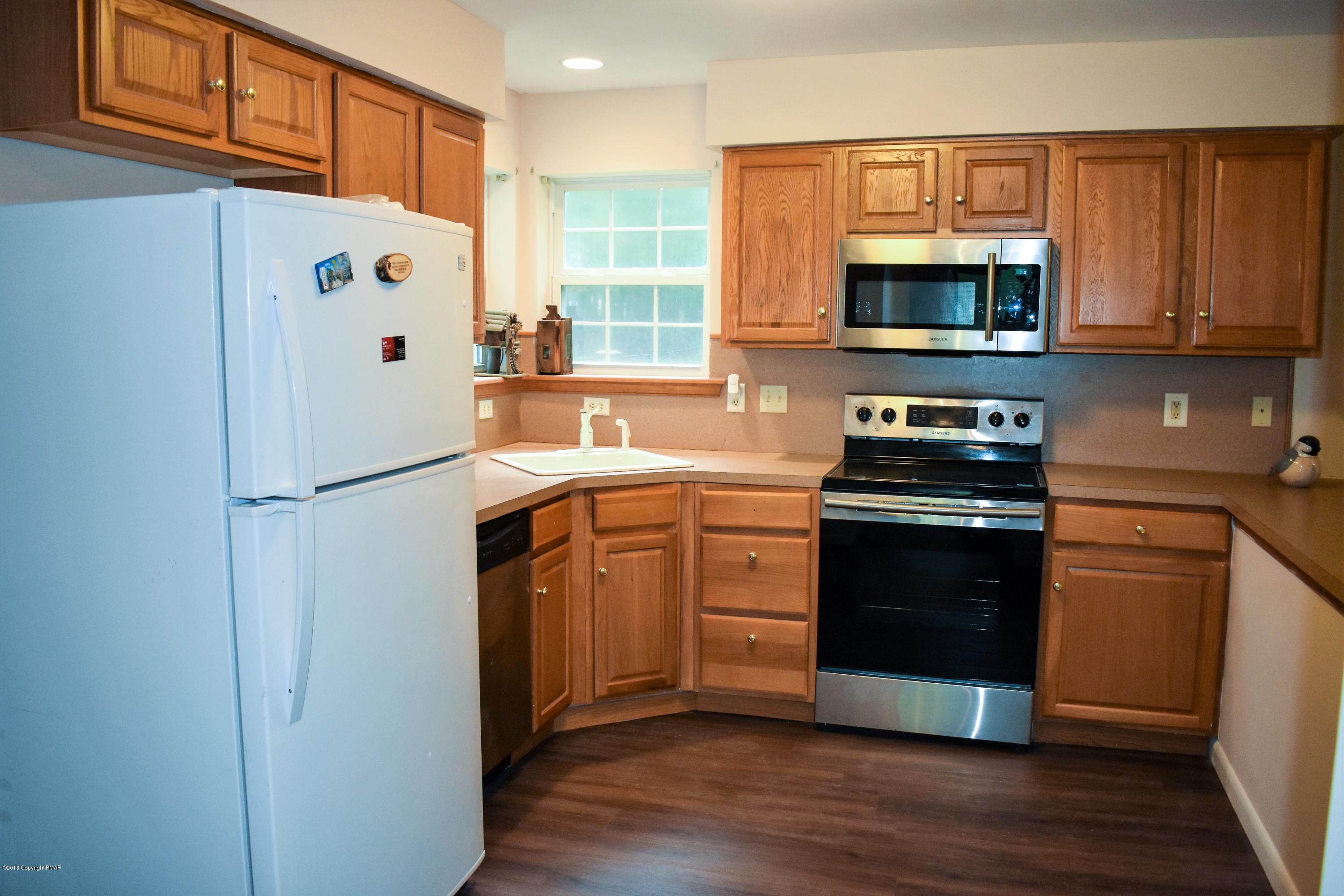 33 Sassafras Road Albrightsville, PA 18210 - Photo 13 of 36 a kitchen with stainless steel appliances a refrigerator stove and sink