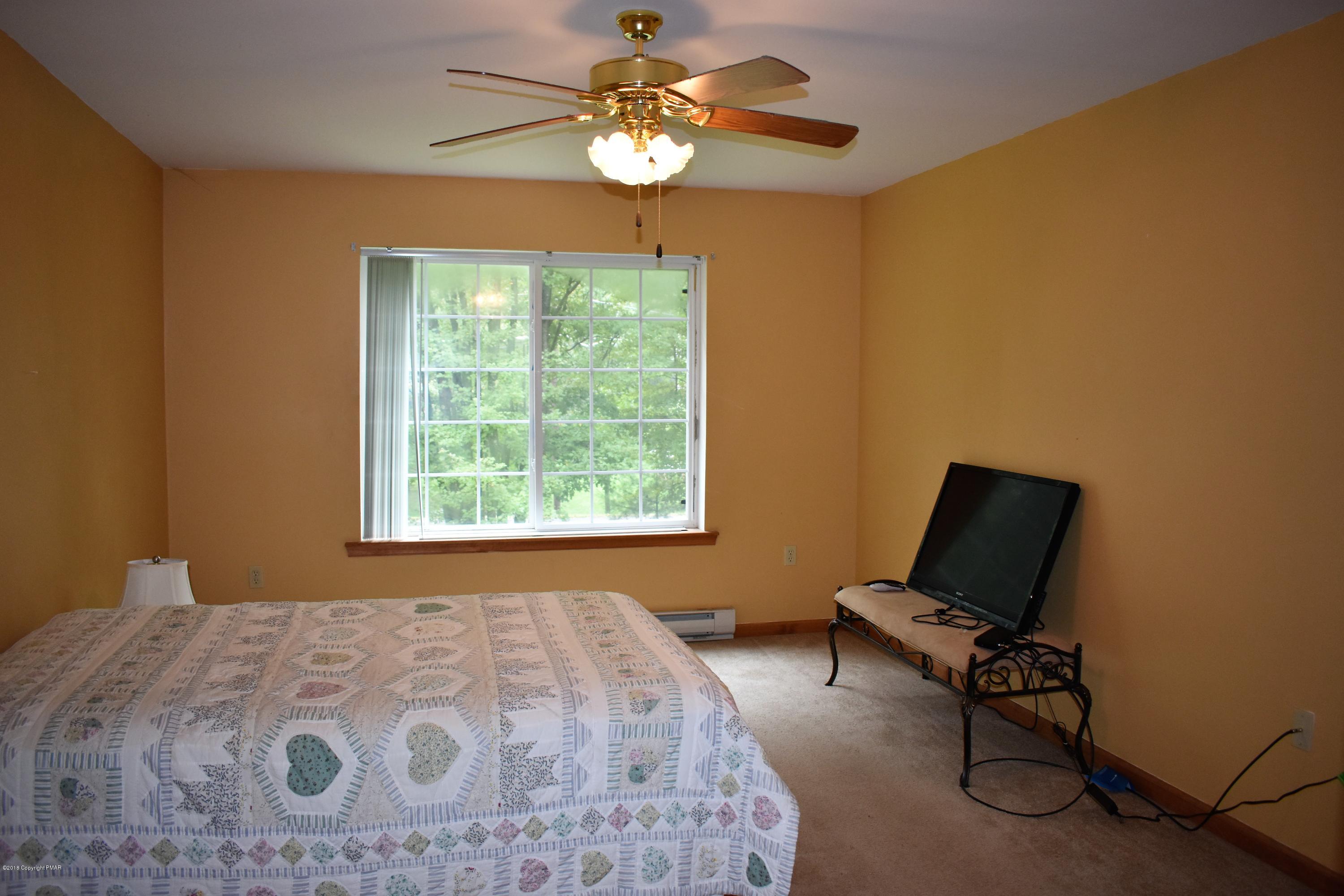 33 Sassafras Road Albrightsville, PA 18210 - Photo 18 of 36 a bedroom with a bed and a window