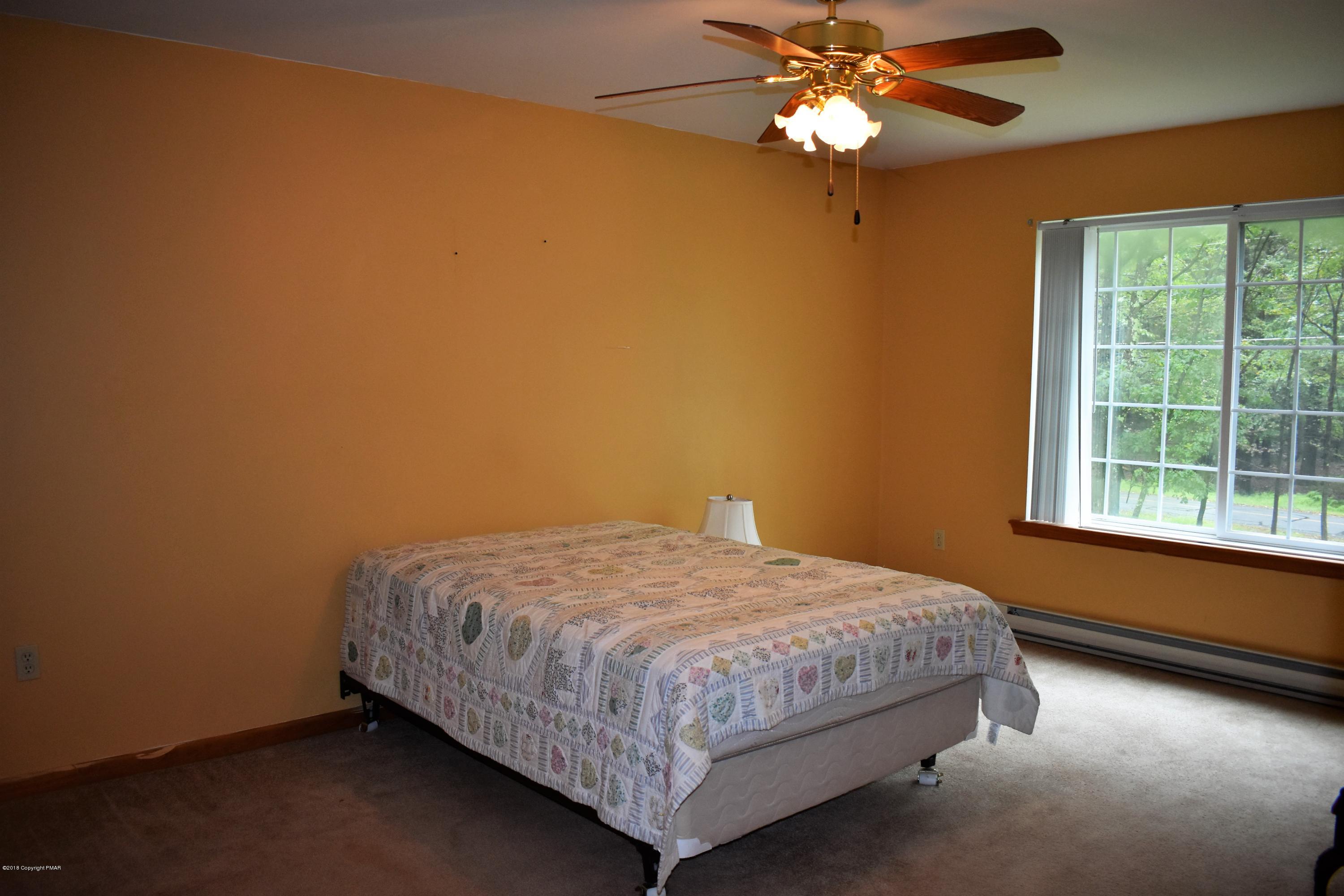 33 Sassafras Road Albrightsville, PA 18210 - Photo 19 of 36 a bedroom with a bed and a window