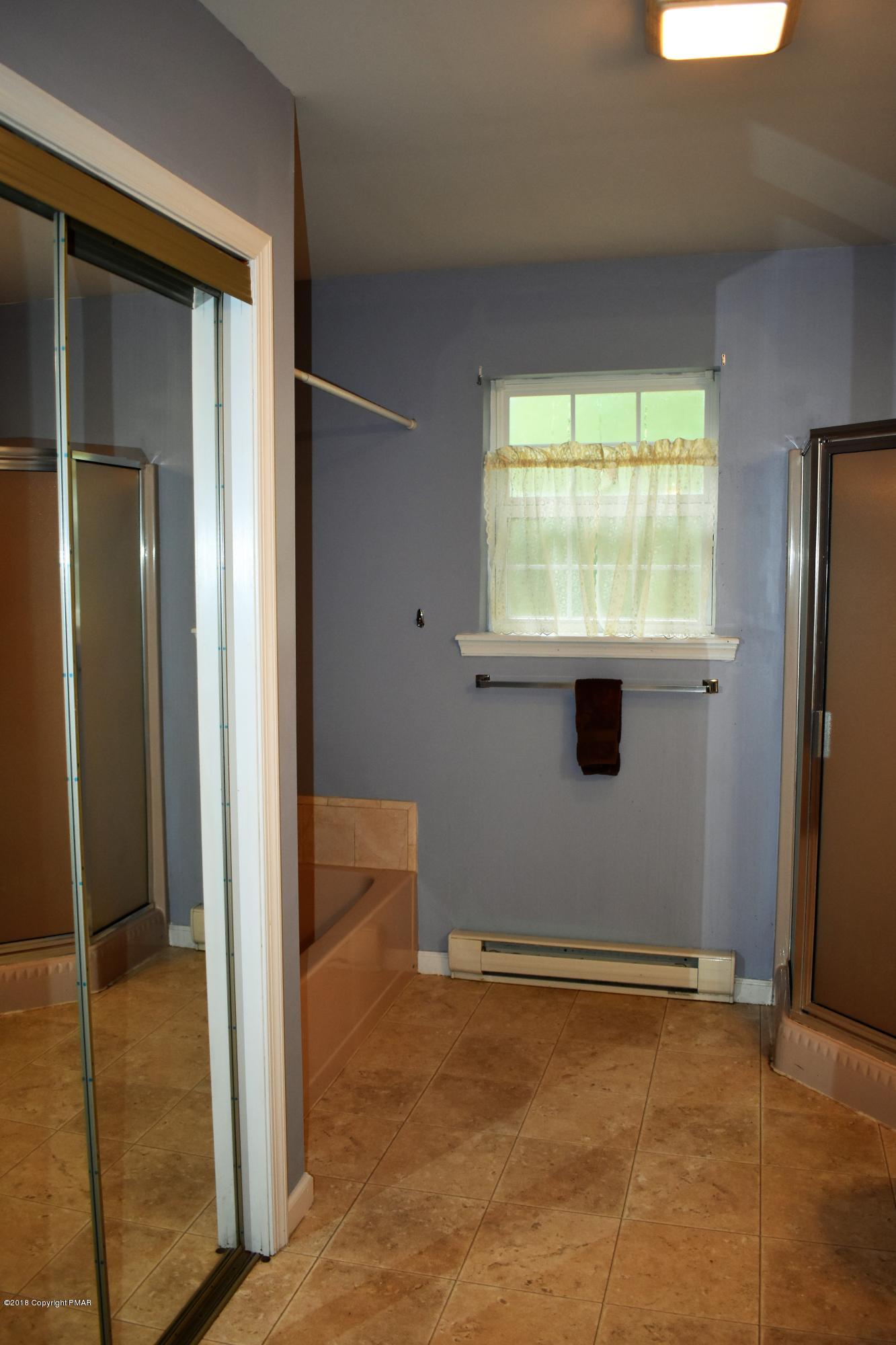 33 Sassafras Road Albrightsville, PA 18210 - Photo 23 of 36 a view of a livingroom with an empty space and a window